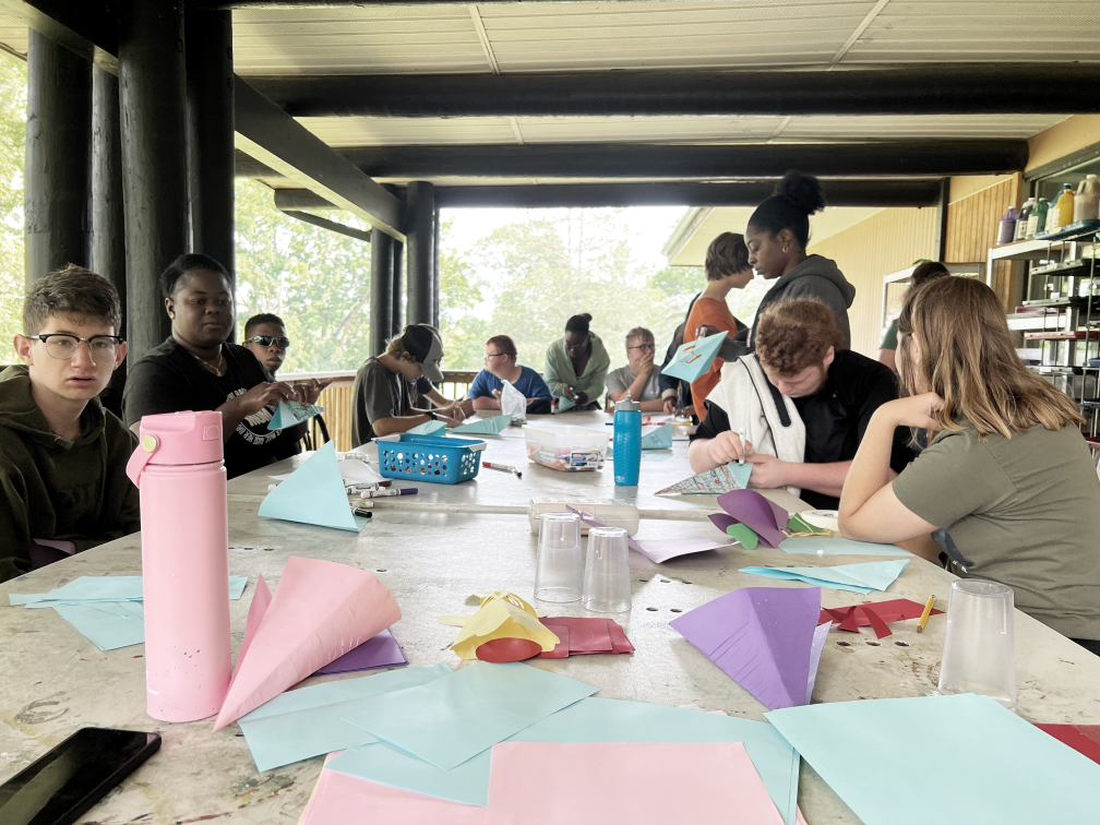 A group of campers spend the afternoon at craft time