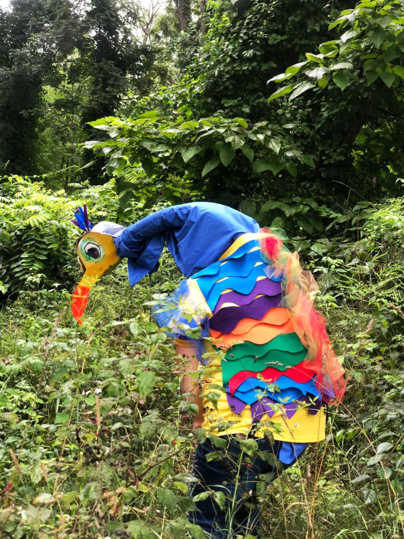 A camp counsellor disguised as a snipe for an outdoor game. All our activities encourage exploration and fun!