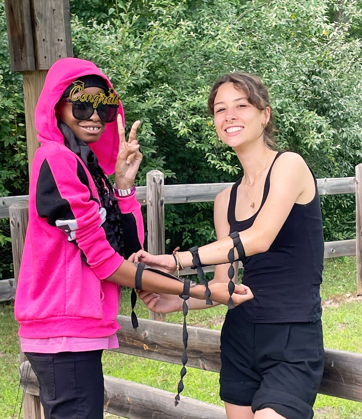 Camper and Staff at Archery Range